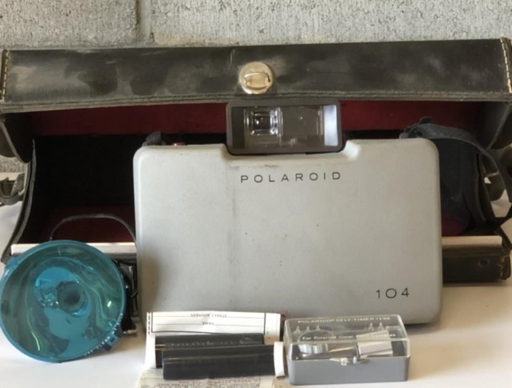 Vintage Polaroid camera with case and accessories