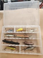 Assorted fishing lures and case