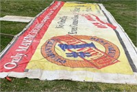 CANVAS TARP w/ ADVERTISEMENT ROUGHLY 45X18 FT