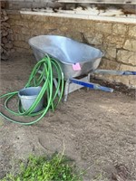 Wheelbarrow, hose, bucket