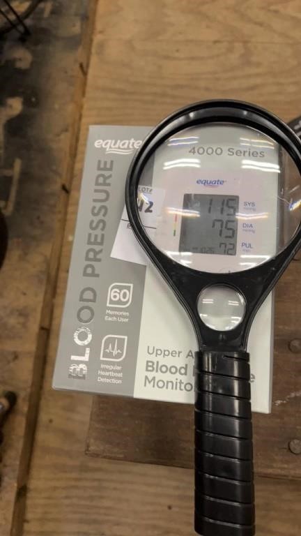 Blood pressure monitor and magnifying glass