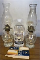 Quantity two oil lamps, 64 ounces of lamp, oil,