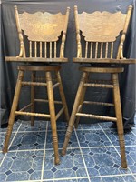 2 press back oak swivel bar stools
