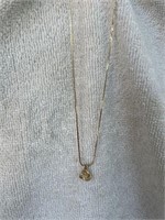 14KT GOLD AND DIAMOND KNOT PENDANT ON A 24KT GOLD