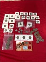 Assortment of US coins, most are nickels. Liberty