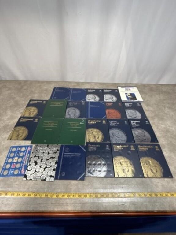 Assortment of empty coin collection folders, most