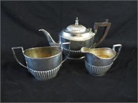 A Three Piece Silver Plate Tea Service