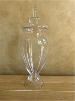 Tall covered glass jar;