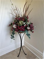 Metal stand with faux flowers