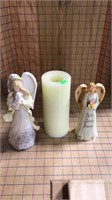 Angels and battery operated candle