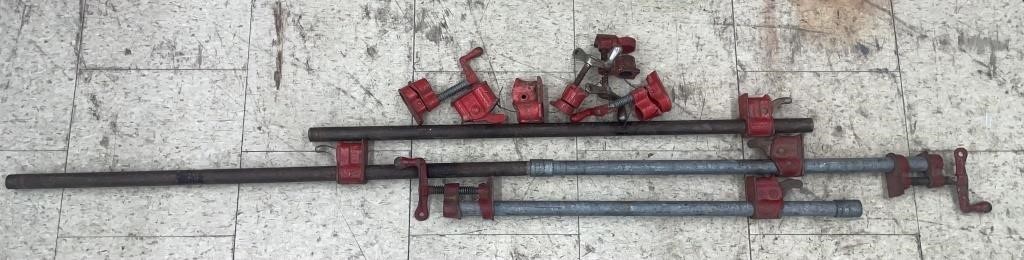 Three pipe clamps with extra clamp parts. Approx.