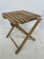 Short wooden folding stool.