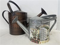 Pair of metal watering cans. One is galvanized