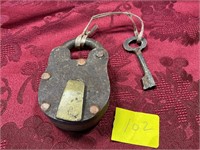 Antique padlock with key iron with brass band