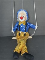 Porcelain Clown Doll Sitting on Swing