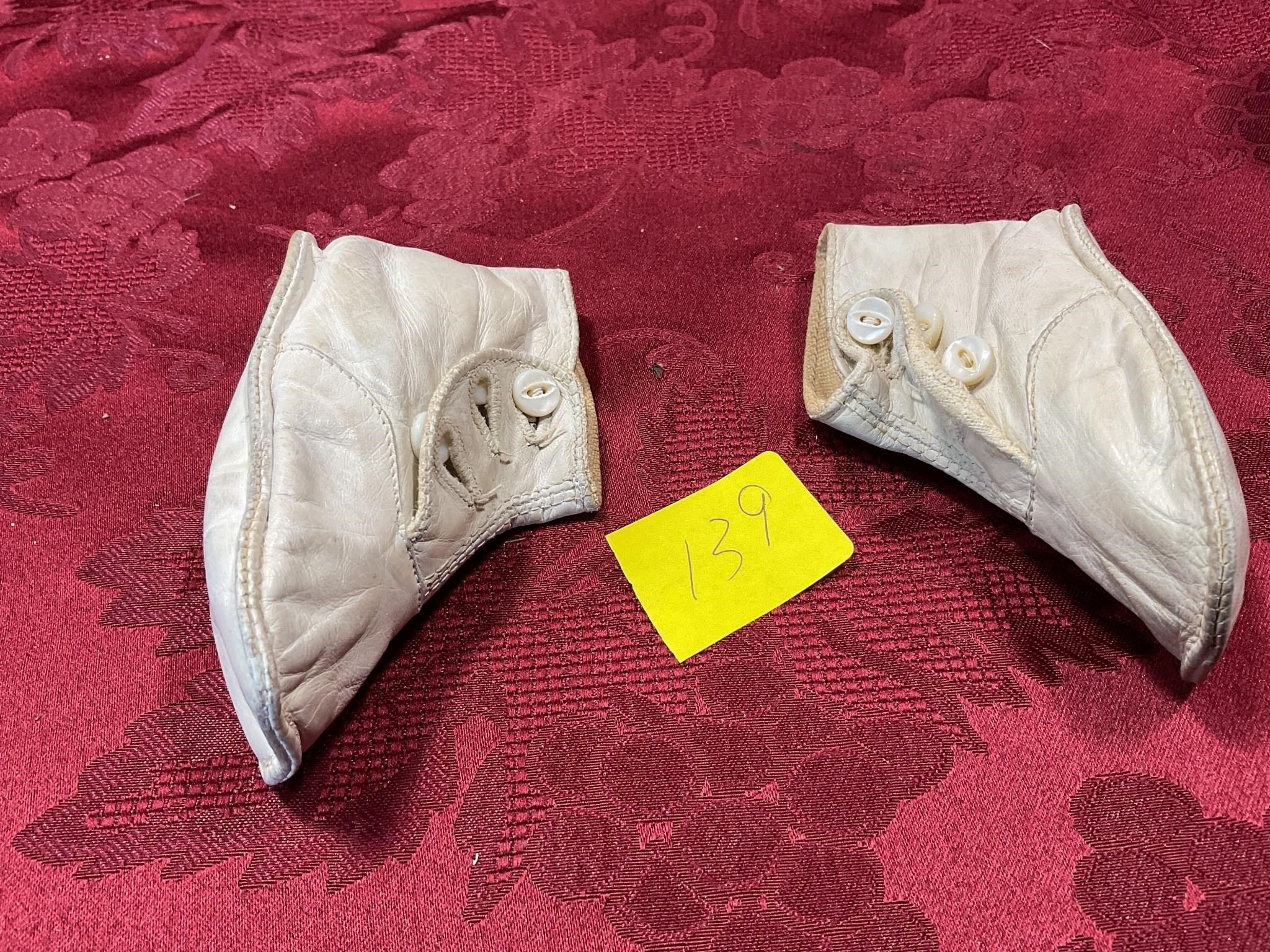 Antique leather baby shoes with buttons