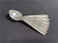 Group of eight sterling silver T spoons 90g. In pb