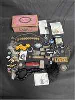 Group of costume jewelry in vintage tin etc in