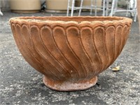 Round terracotta planter with drainage hole