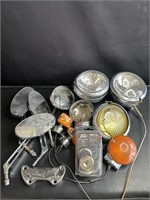 Large group of vintage motorcycle lights