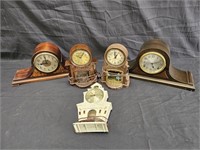 Group of vintage and antique mantel clocks, box