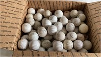E2)  100 golf balls, used, not cleaned