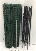 NW) NINE PLASTIC FENCE POSTS & TWO ROLLS OF GREEN