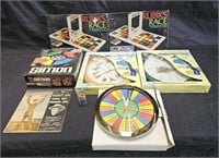 Group of vintage board games with three clocks,