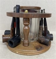 Humidor and six tobacco pipes on stand