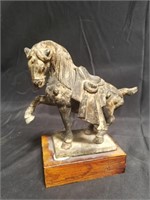 Vintage cast iron horse sculpture on wood base