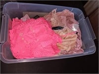 Crochet and lace crop tops in a bin.