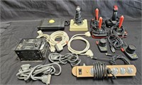 Large group of game controllers with Atari 2600