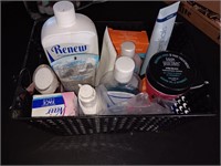 Bin of creams, lotion, hair treatment and more.