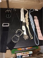 Box of 8 belts with bling on them.