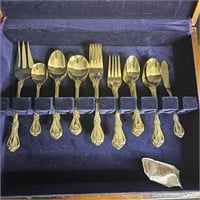 8 person silverware set. Gold plated made in