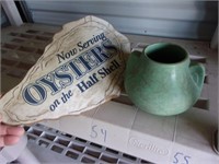 antique vase and oyster sign