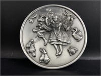 Norman Rockwell inspired pewter disc.  4"