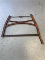 Primitive red bow saw