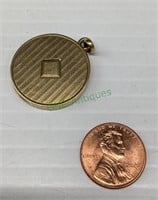 Marked 14k gold locket with photograph. .2 g