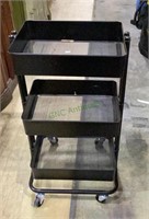 Three tiered metal storage cart on caster