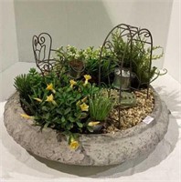 Really cool garden art planter with pho