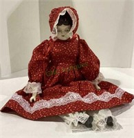 Antique replica porcelain doll with plush body