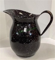 Large speckled enamelware pitcher by USN the