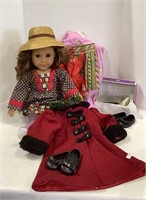 American Girl doll with assorted clothing and