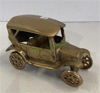 Gold tone metal antique car replica measuring 3