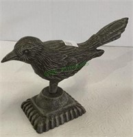 Cast iron bird figure measuring 4 1/2 inches tall