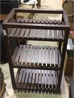 Three tiered shelf rack with caster wheels