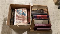 Two boxes of books includes titles such as War
