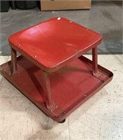 Vintage metal mechanics seat bright red in color