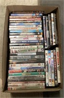 Box of DVDs includes titles such as Spy Kids,